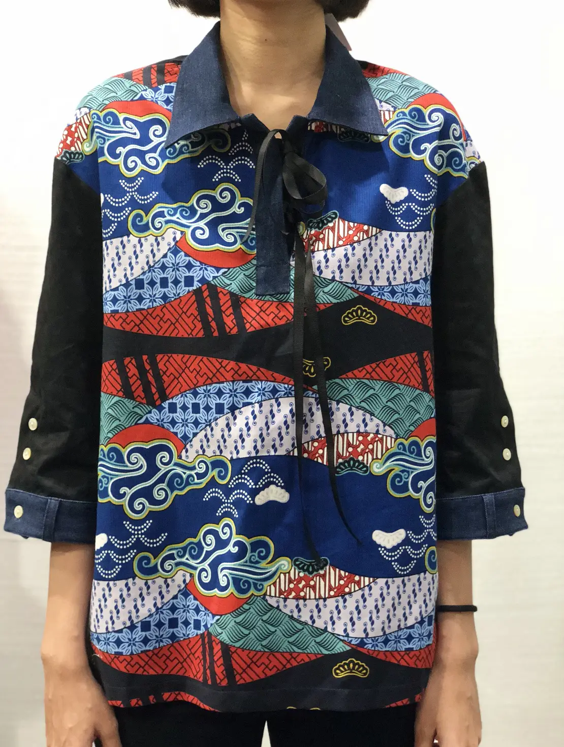 Kampong mountain print applied to a polo shirt