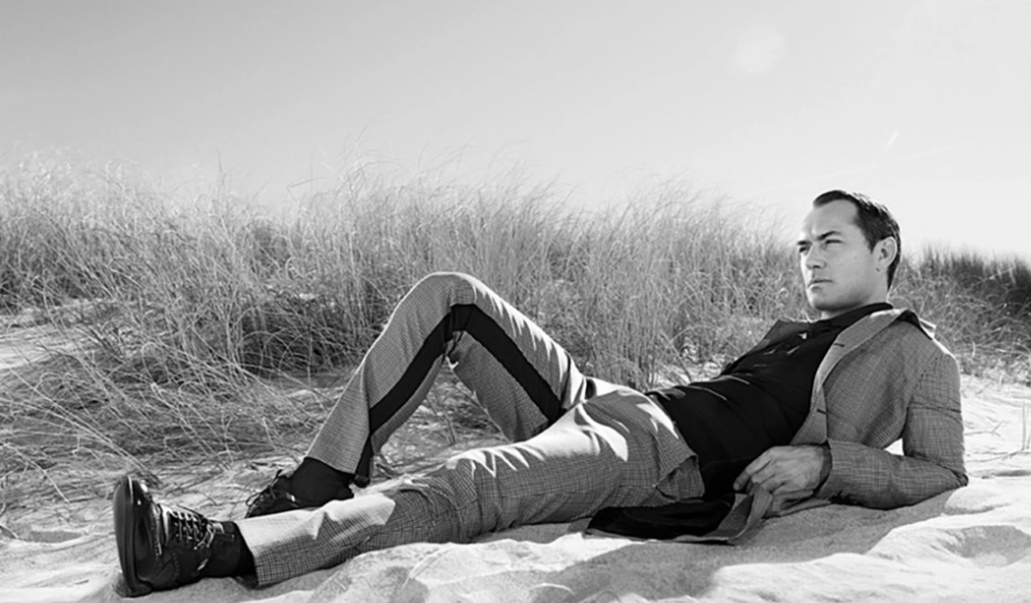 Campaign image reference of seated figure in dunes